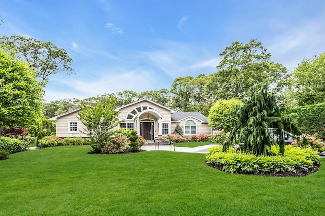 21 Buttonwood Dr, Dix Hills, NY 11746 - view of front of home with a front lawn