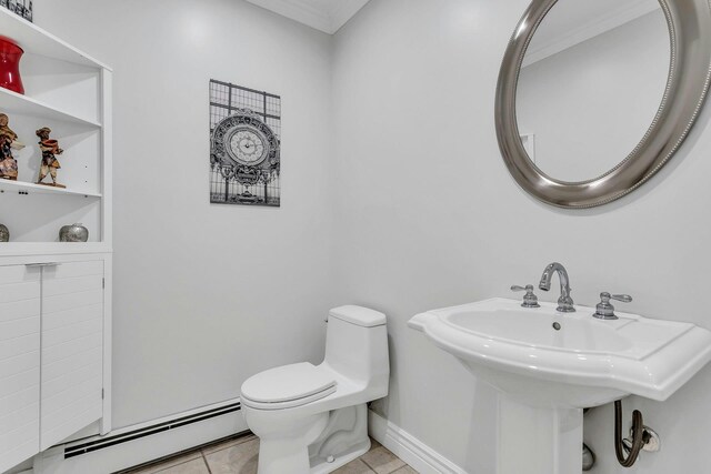 21 Buttonwood Dr, Dix Hills, NY 11746 - bathroom featuring baseboard heating, tile patterned floors, toilet, a sink, and baseboards