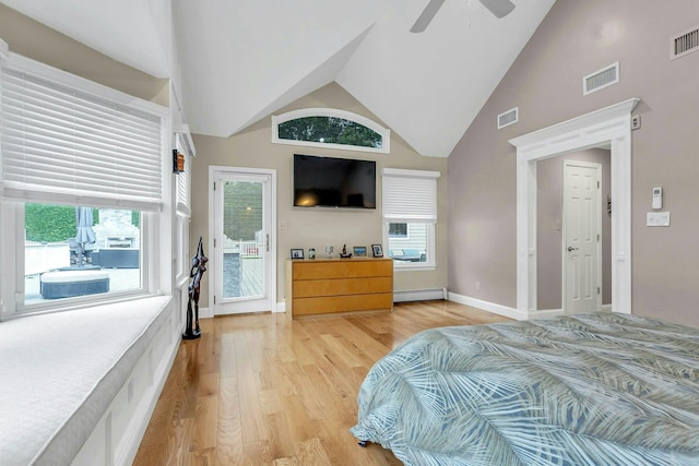 21 Buttonwood Dr, Dix Hills, NY 11746 - bedroom with light wood-style flooring, baseboard heating, ceiling fan, baseboards, and high vaulted ceiling