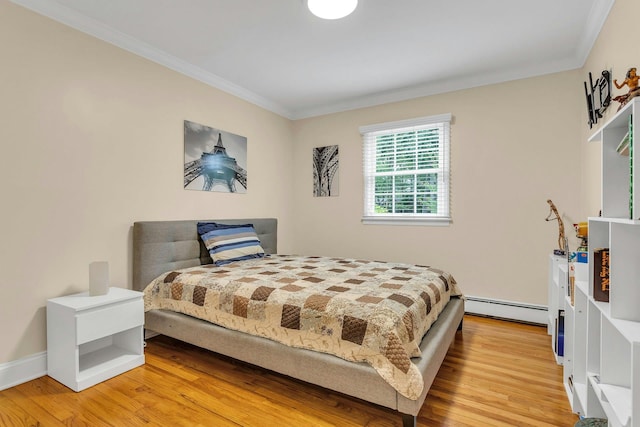 21 Buttonwood Dr, Dix Hills, NY 11746 - bedroom featuring baseboard heating, ornamental molding, and light wood-style flooring