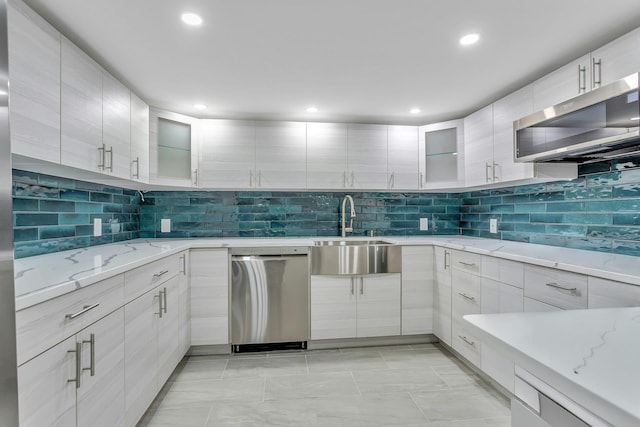 21 Buttonwood Dr, Dix Hills, NY 11746 - kitchen with appliances with stainless steel finishes, a sink, decorative backsplash, glass insert cabinets, and recessed lighting