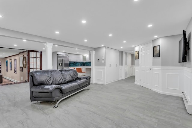 21 Buttonwood Dr, Dix Hills, NY 11746 - living area featuring a decorative wall, ornate columns, recessed lighting, a baseboard radiator, and a wainscoted wall