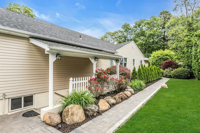 21 Buttonwood Dr, Dix Hills, NY 11746 - view of side of property with a shingled roof and a lawn