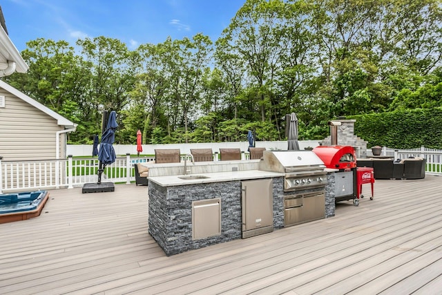 21 Buttonwood Dr, Dix Hills, NY 11746 - wooden deck featuring a sink, view of scattered trees, and an outdoor living space