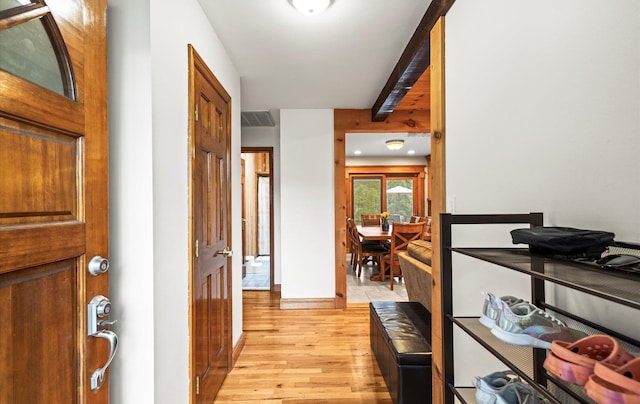 11 Gilford Ct, Melville, NY 11747 - corridor with light wood finished floors, beamed ceiling, and baseboards