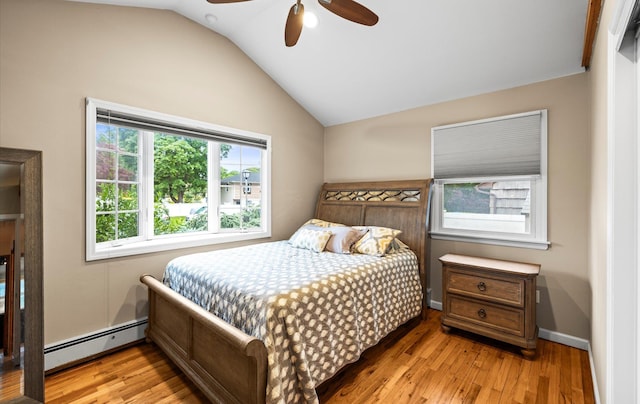 11 Gilford Ct, Melville, NY 11747 - bedroom with a baseboard radiator, wood finished floors, lofted ceiling, and ceiling fan