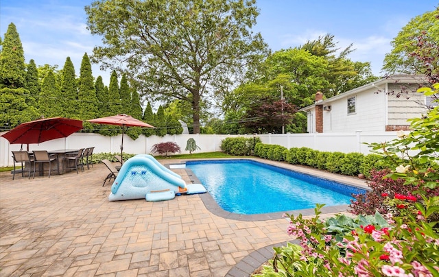 11 Gilford Ct, Melville, NY 11747 - view of swimming pool featuring a patio area, a fenced backyard, and outdoor dining space