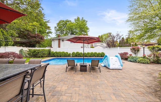 11 Gilford Ct, Melville, NY 11747 - view of swimming pool with a fenced backyard, outdoor dining space, and a patio area