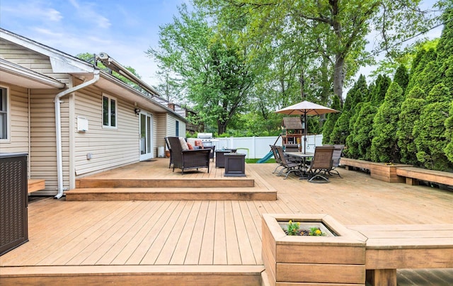 11 Gilford Ct, Melville, NY 11747 - wooden deck featuring outdoor dining area and an outdoor living space with a fire pit