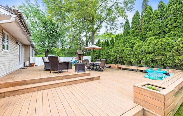 11 Gilford Ct, Melville, NY 11747 - deck featuring outdoor dining area and a playground