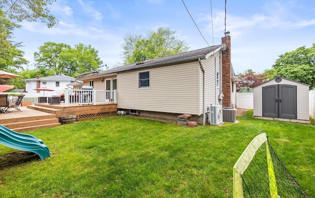 11 Gilford Ct, Melville, NY 11747 - rear view of property featuring a chimney, a wooden deck, and central AC unit