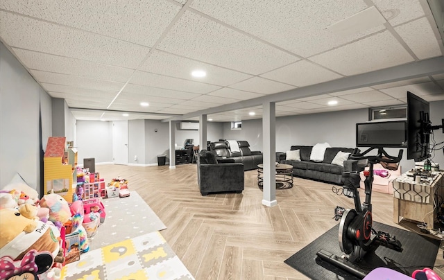 11 Gilford Ct, Melville, NY 11747 - exercise room featuring baseboards, an AC wall unit, recessed lighting, and a paneled ceiling