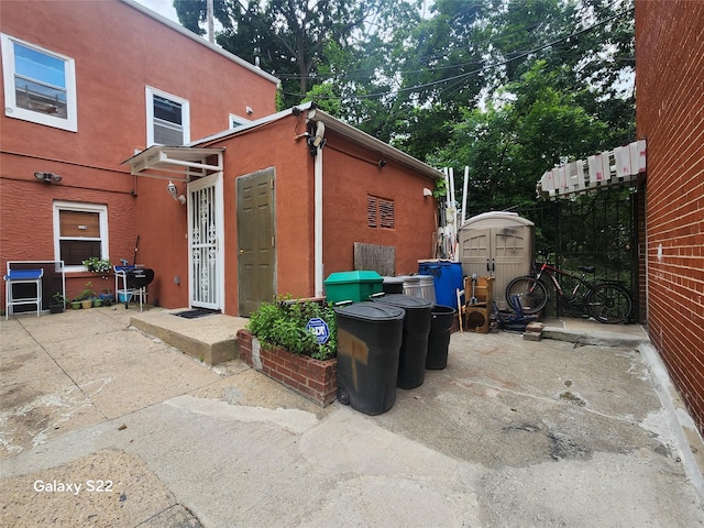 32 Yonkers Ave, Yonkers, NY 10701 - view of side of home with stucco siding and a patio area