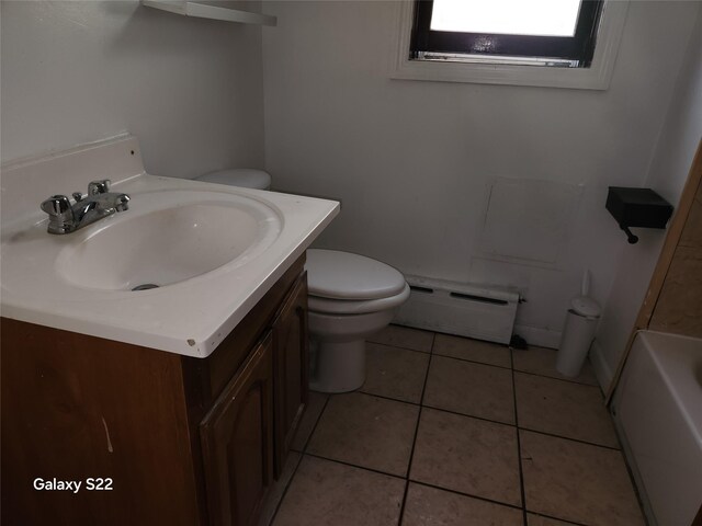 32 Yonkers Ave, Yonkers, NY 10701 - bathroom featuring a baseboard radiator, toilet, vanity, a bathtub, and tile patterned flooring