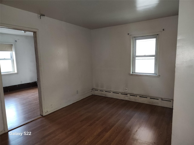 32 Yonkers Ave, Yonkers, NY 10701 - spare room featuring plenty of natural light, wood finished floors, and a baseboard radiator