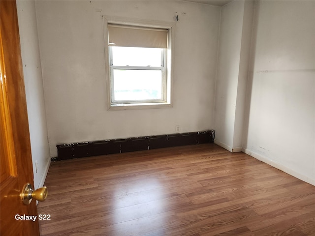 32 Yonkers Ave, Yonkers, NY 10701 - spare room with wood finished floors and baseboards