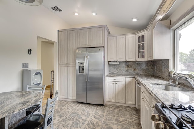 27 Suzanne Ln, Bethpage, NY 11714 - kitchen featuring stainless steel fridge with ice dispenser, lofted ceiling, stove, light stone countertops, and a sink