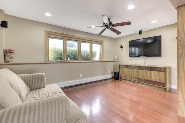 27 Suzanne Ln, Bethpage, NY 11714 - living room with a baseboard heating unit, wood finished floors, a ceiling fan, recessed lighting, and baseboards