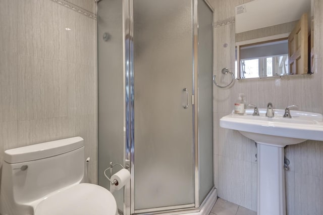 27 Suzanne Ln, Bethpage, NY 11714 - full bathroom with a stall shower, toilet, tile patterned flooring, tile walls, and a sink