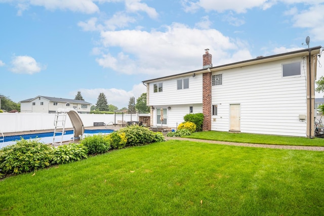 27 Suzanne Ln, Bethpage, NY 11714 - back of property featuring a chimney