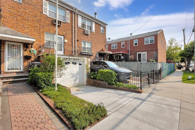 69-14 61st Rd, Middle Village, NY 11379 - view of property featuring concrete driveway and a garage