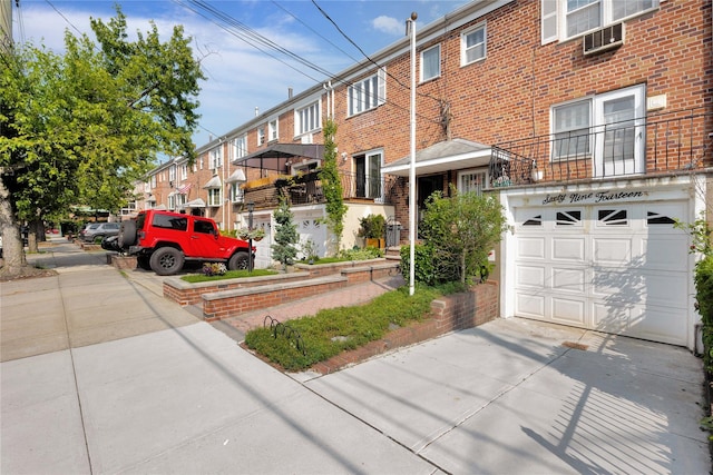 69-14 61st Rd, Middle Village, NY 11379 - view of building exterior with concrete driveway and an attached garage