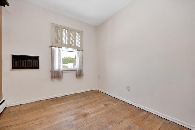 69-14 61st Rd, Middle Village, NY 11379 - empty room featuring hardwood / wood-style flooring and baseboards
