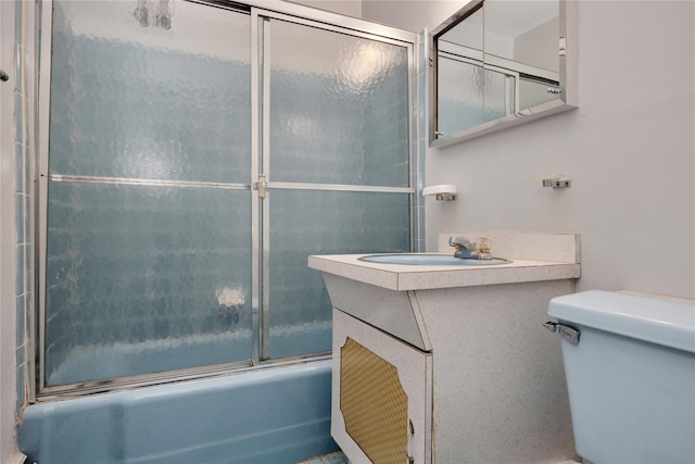 69-14 61st Rd, Middle Village, NY 11379 - full bathroom featuring toilet, bath / shower combo with glass door, and vanity