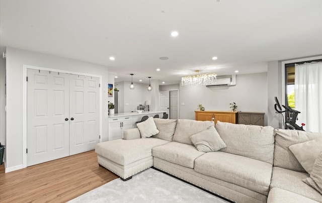 1101 162nd St Unit 6C, Beechhurst, NY 11357 - living room featuring light wood-style flooring, recessed lighting, and a wall mounted AC