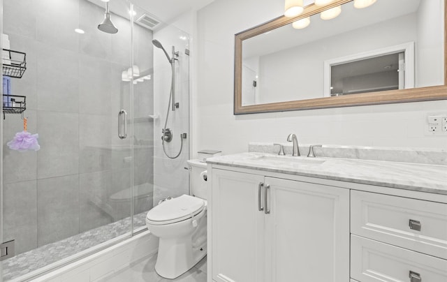 1101 162nd St Unit 6C, Beechhurst, NY 11357 - full bathroom featuring toilet, vanity, a shower stall, and tile walls
