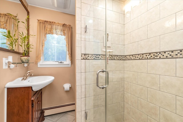 517 Birch St, West Hempstead, NY 11552 - bathroom featuring a baseboard radiator, a stall shower, vanity, and tile patterned flooring