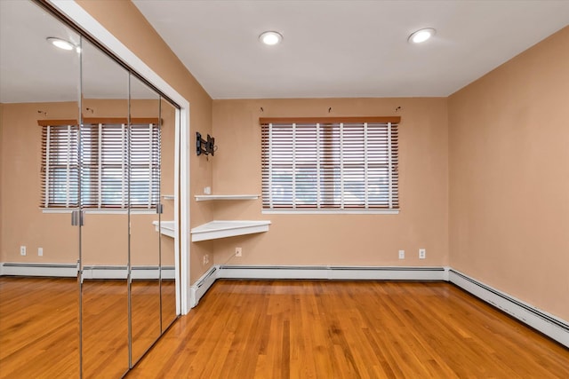 517 Birch St, West Hempstead, NY 11552 - unfurnished room with light wood-style flooring, recessed lighting, and a baseboard radiator
