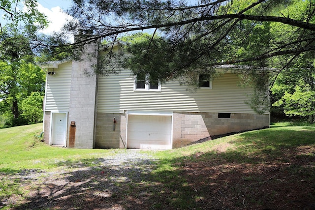 342 Bernas Rd, Cochecton, NY 12726 - view of side of property featuring an attached garage, a chimney, and a yard