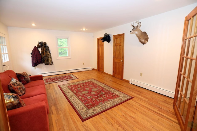 342 Bernas Rd, Cochecton, NY 12726 - living area with a baseboard heating unit, light wood-type flooring, recessed lighting, and baseboards