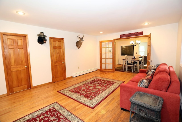 342 Bernas Rd, Cochecton, NY 12726 - living room with a baseboard heating unit, a chandelier, wood finished floors, recessed lighting, and baseboards