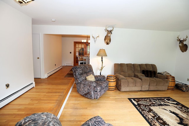 342 Bernas Rd, Cochecton, NY 12726 - living room featuring a baseboard radiator, wood finished floors, and a chandelier