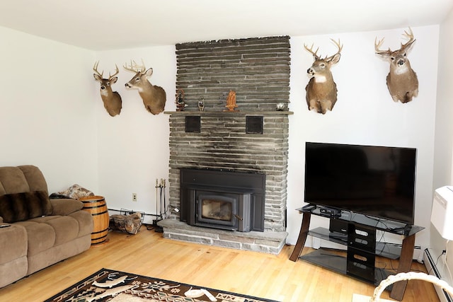 342 Bernas Rd, Cochecton, NY 12726 - living room with wood finished floors, a large fireplace, and baseboard heating