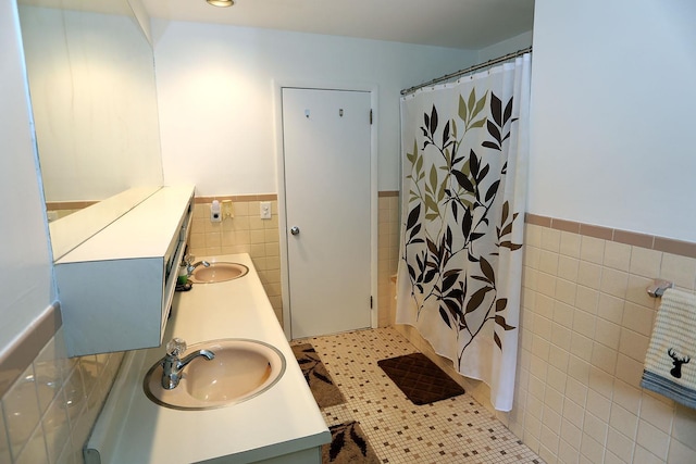 342 Bernas Rd, Cochecton, NY 12726 - bathroom featuring tile walls, wainscoting, double vanity, a shower with shower curtain, and tile patterned floors