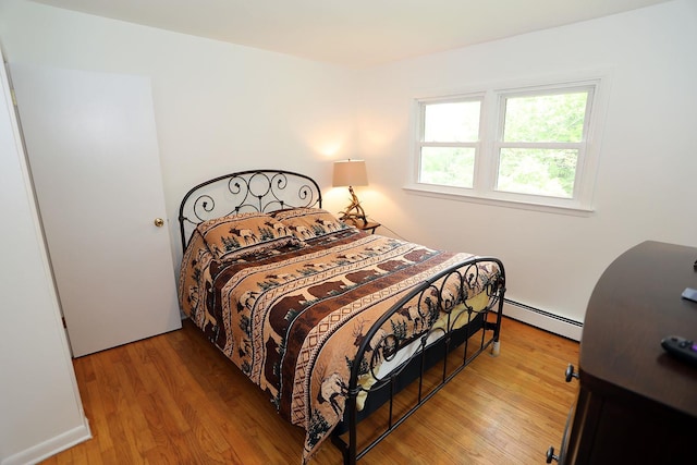 342 Bernas Rd, Cochecton, NY 12726 - bedroom with a baseboard radiator and light wood-style flooring