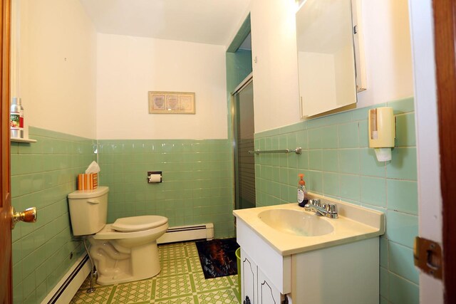 342 Bernas Rd, Cochecton, NY 12726 - bathroom with a baseboard radiator, tile walls, wainscoting, an enclosed shower, and toilet
