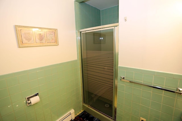 342 Bernas Rd, Cochecton, NY 12726 - bathroom with tile walls, a stall shower, and wainscoting