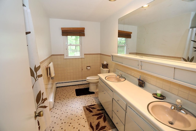 342 Bernas Rd, Cochecton, NY 12726 - full bathroom featuring tile walls, baseboard heating, healthy amount of natural light, double vanity, and a wainscoted wall