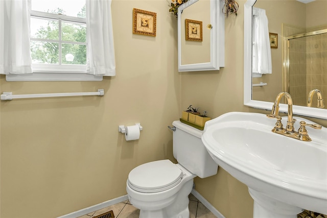 16 Abbey Ln, East Setauket, NY 11733 - bathroom featuring baseboards, a sink, toilet, tile patterned flooring, and tiled shower
