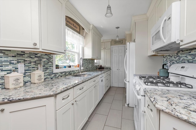 487 Sunnybrook Dr, Oceanside, NY 11572 - kitchen featuring white appliances, decorative backsplash, a sink, light tile patterned floors, and pendant lighting