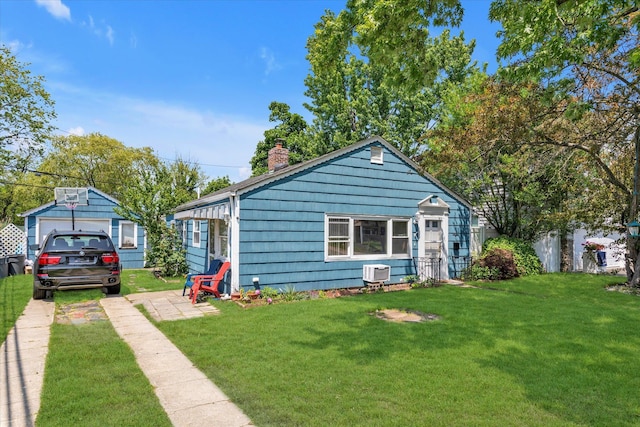 487 Sunnybrook Dr, Oceanside, NY 11572 - view of front of property featuring a chimney, a front lawn, a detached garage, and driveway