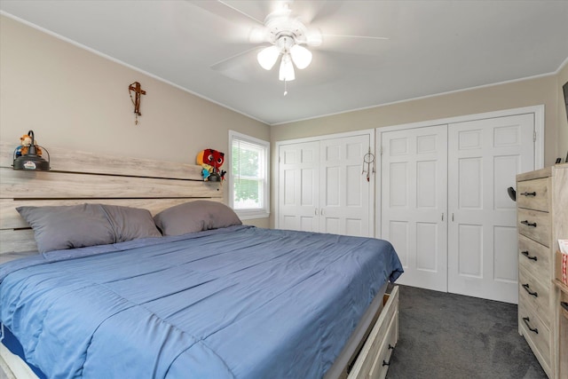 487 Sunnybrook Dr, Oceanside, NY 11572 - bedroom with dark colored carpet, two closets, a ceiling fan, and ornamental molding