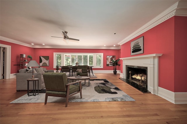 94 Cedar Ave, Poughkeepsie, NY 12603 - living area featuring crown molding, a ceiling fan, a premium fireplace, baseboards, and wood finished floors