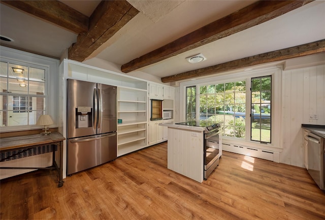 94 Cedar Ave, Poughkeepsie, NY 12603 - kitchen with stainless steel appliances, open shelves, light wood-type flooring, beamed ceiling, and white cabinetry
