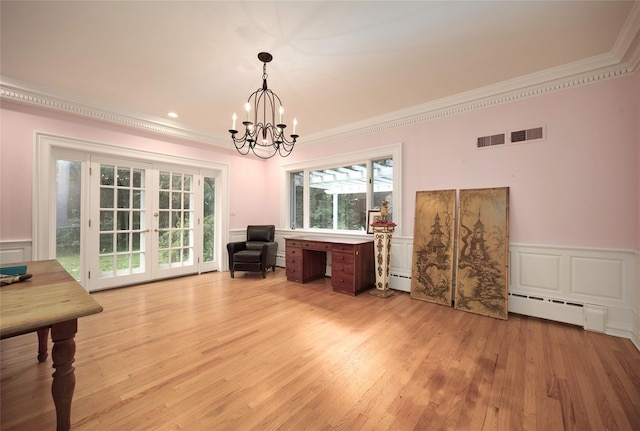 94 Cedar Ave, Poughkeepsie, NY 12603 - interior space featuring crown molding, a baseboard radiator, a chandelier, wainscoting, and light wood finished floors