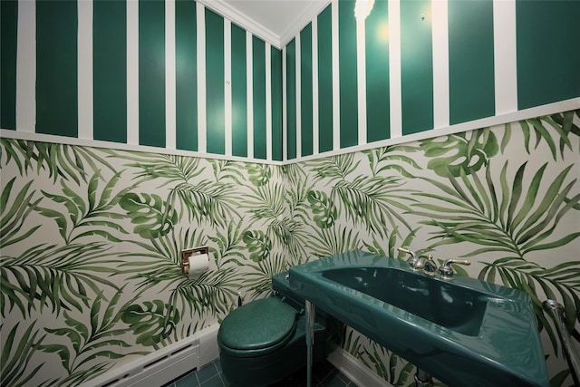 94 Cedar Ave, Poughkeepsie, NY 12603 - half bathroom featuring a baseboard heating unit, toilet, wallpapered walls, and crown molding